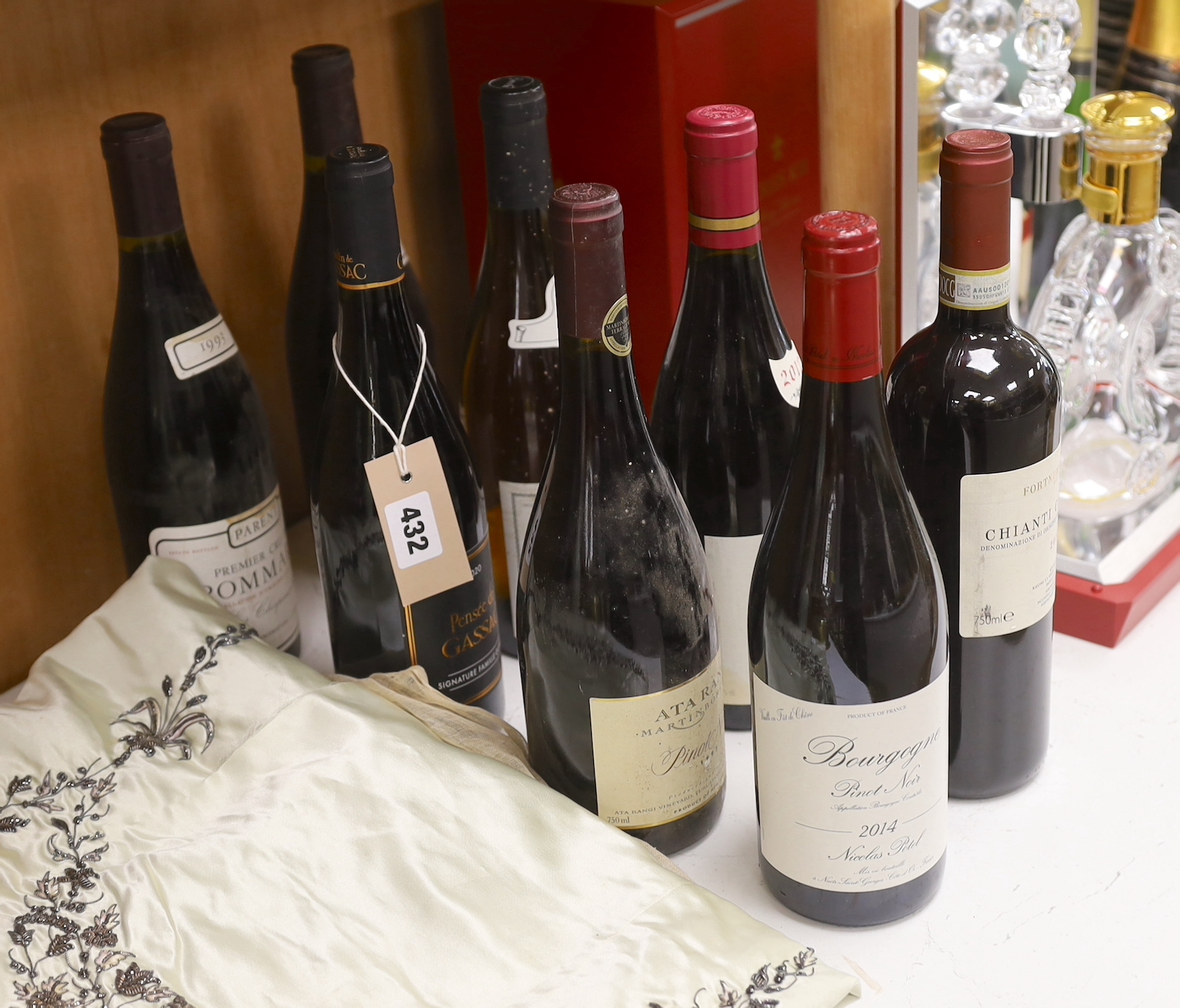 Eight various bottles of wine: Premier Cru De Pommard 1993 (2), Ata Rangi Pinot Noir 1993, Chablis Grand Cru 2001, Pensee De Gassac 2020, Bourgogne Pinot Noir 2014, Fortnum & Mason Chianti Classico 2015 and Bourgogne Ren